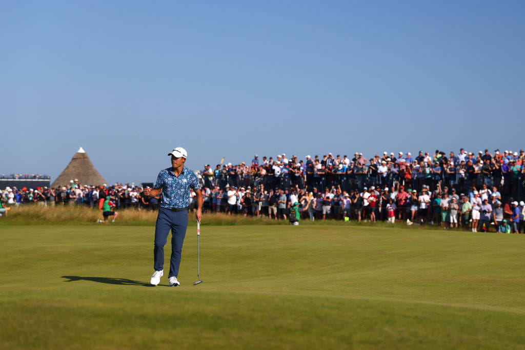 Collin Morikawa celebrates a crucial birdie on the 14th